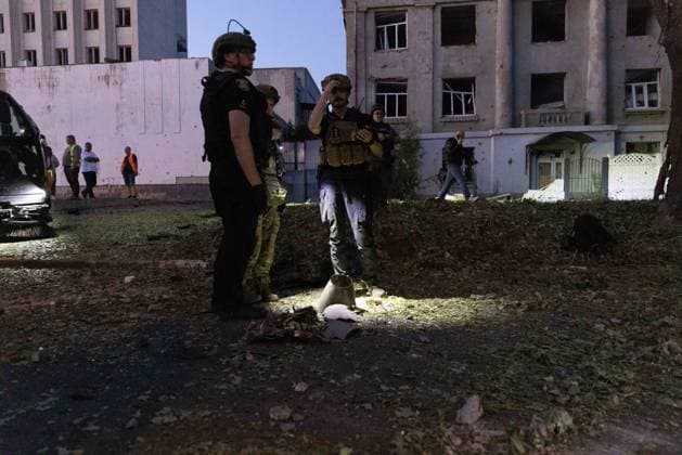 July 17, 2026, Kharkiv, Kharkiv Oblast, UKRAINE: Military personnel and civilians inspect destroyed military equipment and debris scattered across ground following a russian banderol missile attack in Shevchenkivskyi District, Kharkiv, Ukraine, on July 17, 2026. The strike killed one 40-year-old man in his vehicle and wounded seven others who were hospitalized; educational, administrative and commercial buildings sustained damage. Kharkiv UKRAINE  - ZUMAt164 20260717_zip_t164_003 Copyright: xYevhenxTitovx
