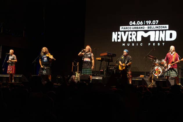 17.07.2026, Bellinzona, Parco Urbano, Nevermind Music Fest 2026: Modena City Ramblers, Franco D Aniello (flute, tin whistle, trumpet, sax, backing vocals, acoustic guitar, glockenspiel, percussion), Francesco Fry Moneti (guitars, fiddle, banjo, mandolin, backing vocals), Davide Dudu Morandi (lead vocals, bass, guitar, banjo, glockenspiel, harmonica), Riccardo Sgavetti (bass, acoustic guitar) and Massimo Ice Ghiacci (bass, sax, backing vocals, acoustic guitar) Bellinzona Parco Urbano Ticino Switzerland *** July 17, 2026, Bellinzona, Parco Urbano, Nevermind Music Fest 2026 Modena City Ramblers, Franco D’Aniello—flute, tin whistle, trumpet, saxophone, backing vocals, acoustic guitar, glockenspiel, percussion—Francesco Fry Moneti—guitars, Copyright: xJustPictures.ch FrancescoxMinghettix jp-en-FrMi-_NG_0298