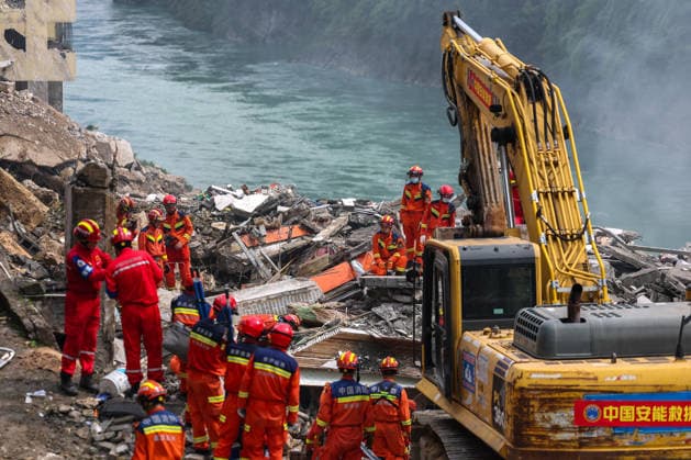 (260718) -- BEIJING, July 18, 2026 -- Rescuers work at the site of a mountain collapse in Pengshui Miao and Tujia Autonomous County, southwest China s Chongqing Municipality, July 17, 2026. Eight people have been confirmed dead and 34 others remain missing after a rainfall-induced mountain collapse occurred along a section of the Wujiang River in southwest China s Chongqing Municipality on Friday, local authorities said. Ten people have been rescued, and search and rescue operations are underway, according to a press briefing held on Friday night. ) XINHUA PHOTOS OF THE DAY HuangxWei 