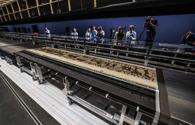 The Bayeux tapestry 17.07.2026. The Bayeux tapestry is laid flat and gently uncovered by French and British conservators behind the 70 meter long glass case that it will be displayed in at The British Museum.  Copyright: xRichardxPohlex NINTCHDBPICT001095943431