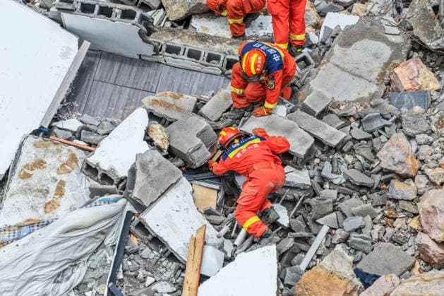 (260718) -- CHONGQING, July 18, 2026 -- A drone photo taken on July 18, 2026 shows rescuers working at the site of a mountain collapse in Pengshui Miao and Tujia Autonomous County, southwest China s Chongqing Municipality. The geological disaster occurred at 9:08 a.m. on Friday in the Hanjia sub-district of Pengshui Miao and Tujia Autonomous County in Chongqing, burying more than 10 residential buildings, while leaving some local residents trapped and unaccounted for. More than 800 rescuers and over 1,100 sets of equipment have been deployed for on-site search and rescue operations. ) CHINA-CHONGQING-MOUNTAIN COLLAPSE-RESCUE (CN) HuangxWei 