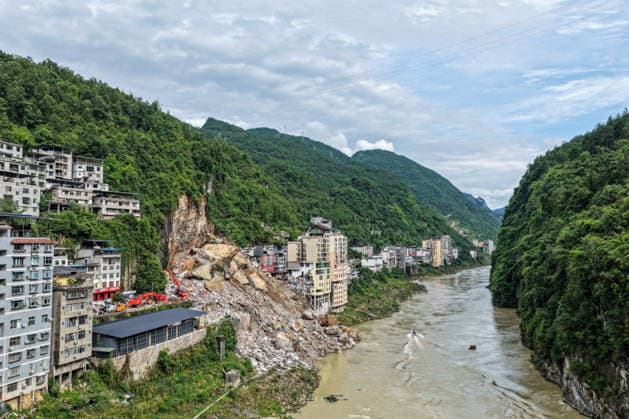 (260718) -- CHONGQING, July 18, 2026 -- An aerial drone photo taken on July 18, 2026 shows the site of a mountain collapse in Pengshui Miao and Tujia Autonomous County, southwest China s Chongqing Municipality. The geological disaster occurred at 9:08 a.m. on Friday in the Hanjia sub-district of Pengshui Miao and Tujia Autonomous County in Chongqing, burying more than 10 residential buildings, while leaving some local residents trapped and unaccounted for. More than 800 rescuers and over 1,100 sets of equipment have been deployed for on-site search and rescue operations. ) CHINA-CHONGQING-MOUNTAIN COLLAPSE-RESCUE (CN) HuangxWei 