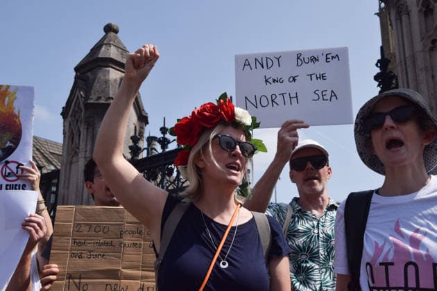 July 18, 2026, London, England, United Kingdom: Activists from Fossil Free London stage a protest outside the parliament calling on incoming Prime Minister Andy Burnham to stop the Rosebank oil and gas field in the North Sea. London United Kingdom - ZUMAv130 20260718_zip_v130_002 Copyright: xVukxValcicx