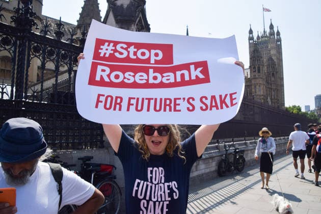 July 18, 2026, London, England, United Kingdom: Activists from Fossil Free London stage a protest outside the parliament calling on incoming Prime Minister Andy Burnham to stop the Rosebank oil and gas field in the North Sea. London United Kingdom  - ZUMAv130 20260718_zip_v130_011 Copyright: xVukxValcicx