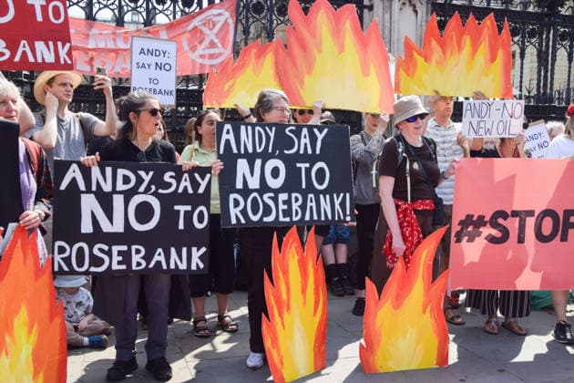 July 18, 2026, London, England, United Kingdom: Activists from Fossil Free London stage a protest outside the parliament calling on incoming Prime Minister Andy Burnham to stop the Rosebank oil and gas field in the North Sea. London United Kingdom  - ZUMAv130 20260718_zip_v130_013 Copyright: xVukxValcicx