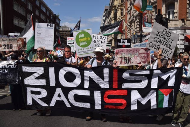 July 18, 2026, London, England, United Kingdom: Protesters hold a Zionism is racism banner as thousands of people march in support of Palestine. London United Kingdom  - ZUMAv130 20260718_zip_v130_022 Copyright: xVukxValcicx