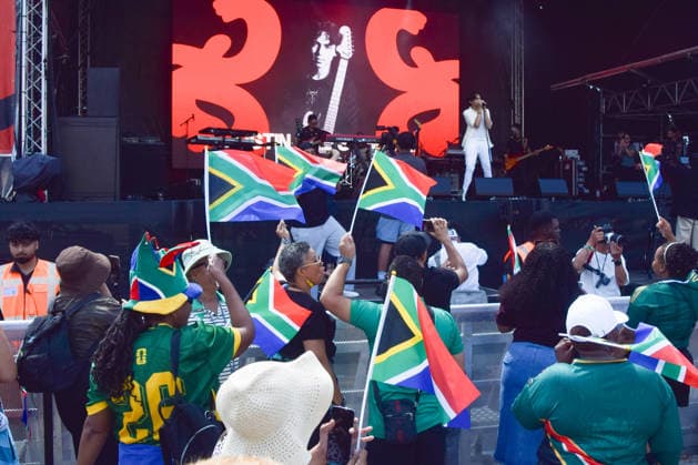July 18, 2026, London, England, United Kingdom: Audience members wave South African flags during a set by singer JUSTIN LEE SCHULTZ at the Nelson Mandela Day celebration in Trafalgar Square, honouring the life and legacy of Nelson Mandela. This year also marks the 30th anniversary of the South African Constitution. London United Kingdom - ZUMAv130 20260718_zip_v130_050 Copyright: xVukxValcicx