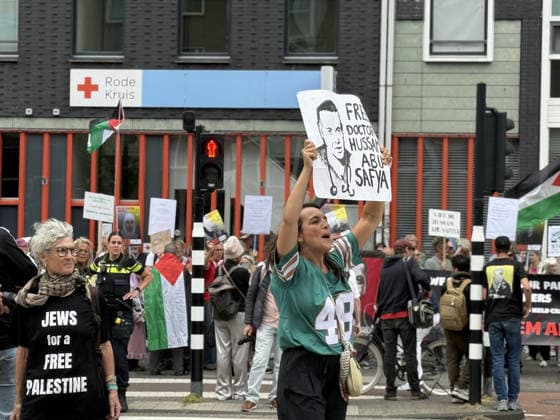 Demonstration in support of Palestine in Amsterdam AMSTERDAM, NETHERLANDS - JULY 18: People gather in front of the Dutch Red Cross (Rode Kruis) to show solidarity with Palestine demanding the release of Dr. Husam Abu Safiya, chief physician of Kamal Adwan Hospital, whose health condition is reportedly worsening while being held in an Israeli prison, and calling on the International Red Cross to visit him, in Amsterdam, the Netherlands on July 18, 2026. Selman Aksunger Anadolu Amsterdam Netherlands. Editorial use only. Please get in touch for any other usage.  Copyright: x2026xAnadoluxSelmanxAksungerx