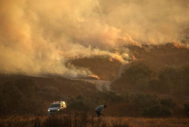 Israeli settlers set fire to Palestinian agricultural lands in Nablus village??????? NABLUS, WEST BANK, PALESTINE - JULY 18: Smoke rise as a large-scale fire burns through Palestinian agricultural lands in the village of Tel, south of Nablus in the West Bank, Palestine on July 18, 2026. A group of Israeli settlers deliberately set fire to the crop fields, forcing local Palestinian landowners to battle the fast-spreading flames with basic tools before emergency fire crews arrived to conduct ground and aerial firefighting operations to contain the blaze. Nedal Eshtayah Anadolu Nablus West Bank. Editorial use only. Please get in touch for any other usage.  Copyright: x2026xAnadoluxNedalxEshtayahx