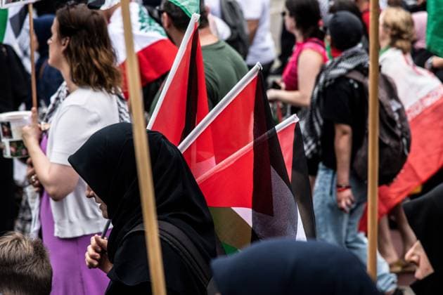 July 18, 2026, Berlin, Germany: BERLIN, GERMANY Ã¢â‚¬ JULY 18, 2026: Hundreds of people march through the streets of Berlin during a pro-Palestinian demonstration calling for an end to the war in Gaza and expressing solidarity with Lebanon and Iran on July 18, 2026. A small group of counter-demonstrators was present along parts of the march under police supervision as officers monitored the demonstration. Andro s Trujillo JNA PRESS Berlin Germany - ZUMAq101 20260718_zna_q101_201 Copyright: xAndro SxTrujillox
