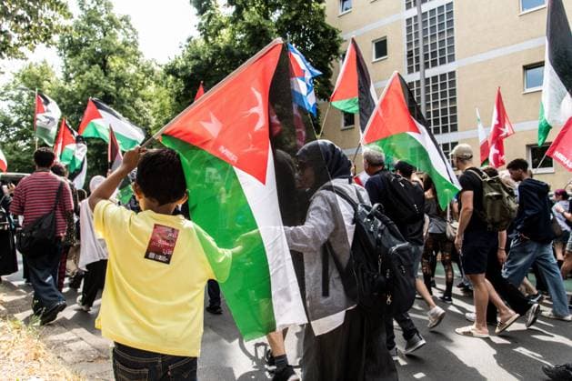 Pro-Palestinian Demonstration Held in Berlin BERLIN, GERMANY JULY 18, 2026: Hundreds of people march through the streets of Berlin during a pro-Palestinian demonstration calling for an end to the war in Gaza and expressing solidarity with Lebanon and Iran on July 18, 2026. A small group of counter-demonstrators was present along parts of the march under police supervision as officers monitored the demonstration. Berlin Germany Copyright: x xAndrÃ sxTrujillox xJNAxPressx