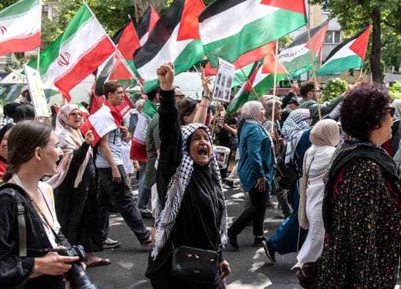 Pro-Palestinian Demonstration Held in Berlin BERLIN, GERMANY JULY 18, 2026: Hundreds of people march through the streets of Berlin during a pro-Palestinian demonstration calling for an end to the war in Gaza and expressing solidarity with Lebanon and Iran on July 18, 2026. A small group of counter-demonstrators was present along parts of the march under police supervision as officers monitored the demonstration. Berlin Germany Copyright: x xAndrÃ sxTrujillox xJNAxPressx