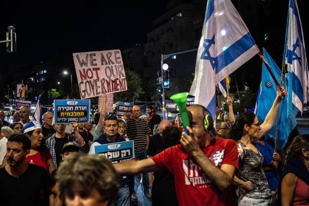 Protest against the Israeli government in West Jerusalem JERUSALEM - JULY 18: People carrying Israeli flags and anti-gov t banners stage a protest against the government of Israeli Prime Minister Benjamin Netanyahu, and call for an end to the attacks on Gaza and Lebanon, in West Jerusalem on July 18, 2026. Mostafa Alkharouf Anadolu Jerusalem Israel. Editorial use only. Please get in touch for any other usage.  Copyright: x2026xAnadoluxMostafaxAlkharoufx