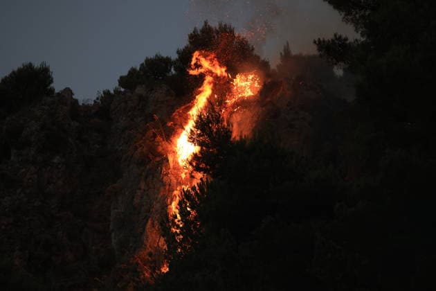 Forest fires continue on the Italian island of Sicily PALERMO, ITALY - JULY 18: Smoke and flames rise from a forest fire spreading across the slopes of Mount Iato near Palermo on the island of Sicily, Italy, on July 18, 2026, as ground and air crews continue their efforts to contain the blaze. Forest fires breaking out at various points on the island are continuing. Alberto Lo Bianco Anadolu Palermo Italy. Editorial use only. Please get in touch for any other usage.  Copyright: x2026xAnadoluxAlbertoxLoxBiancox