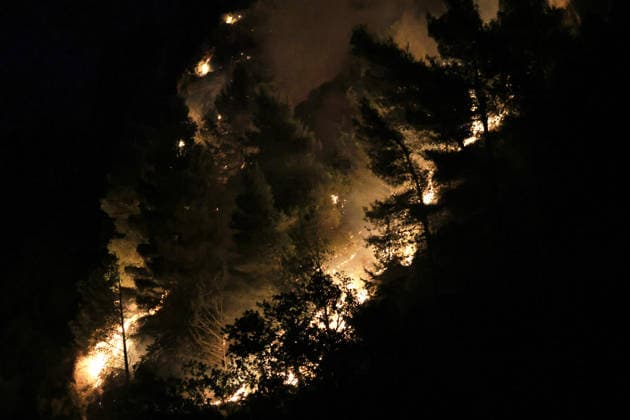 Forest fires continue on the Italian island of Sicily PALERMO, ITALY - JULY 18: The flames are advancing through the forest while the forest fire continues during the night, on the slopes of Mount Iato near Palermo on the island of Sicily, Italy, on July 18, 2026, as ground and air crews continue their efforts to contain the blaze. Forest fires breaking out at various points on the island are continuing. Alberto Lo Bianco Anadolu Palermo Italy. Editorial use only. Please get in touch for any other usage.  Copyright: x2026xAnadoluxAlbertoxLoxBiancox