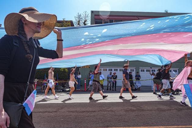 July 18, 2026, San Diego, California, Unted States: People march on the streets with a huge transgender flag during the parade..The 2026 San Diego Pride Parade fills the streets of Hillcrest area with color, energy, and a powerful sense of community as thousands of people gather to celebrate LGBTQ+ pride and equality on July 18th, 2026, in San Diego, California. Participants wave rainbow flags, dance alongside decorated floats, and cheer for local organizations, businesses, and advocacy groups that march through the streets. Allies line the parade route, creating an atmosphere of joy while also recognizing Pride s roots in the fight for equal rights. San Diego Unted States  - ZUMAs197 20260718_aaa_s197_105 Copyright: xWaixLeexMichaelxHox