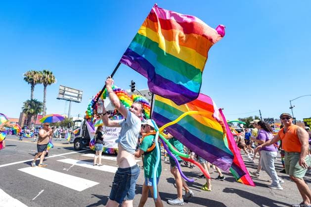 July 18, 2026, San Diego, California, Unted States: People march on the streets with rainbow flags during the parade..The 2026 San Diego Pride Parade fills the streets of Hillcrest area with color, energy, and a powerful sense of community as thousands of people gather to celebrate LGBTQ+ pride and equality on July 18th, 2026, in San Diego, California. Participants wave rainbow flags, dance alongside decorated floats, and cheer for local organizations, businesses, and advocacy groups that march through the streets. Allies line the parade route, creating an atmosphere of joy while also recognizing Pride s roots in the fight for equal rights. San Diego Unted States  - ZUMAs197 20260718_aaa_s197_119 Copyright: xWaixLeexMichaelxHox