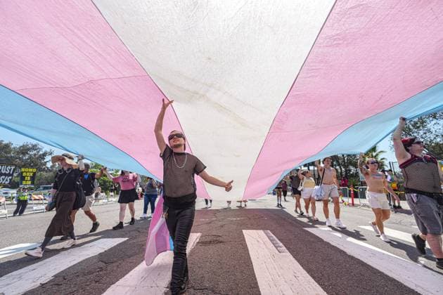 July 18, 2026, San Diego, California, Unted States: People march on the streets with a huge transgender flag during the parade..The 2026 San Diego Pride Parade fills the streets of Hillcrest area with color, energy, and a powerful sense of community as thousands of people gather to celebrate LGBTQ+ pride and equality on July 18th, 2026, in San Diego, California. Participants wave rainbow flags, dance alongside decorated floats, and cheer for local organizations, businesses, and advocacy groups that march through the streets. Allies line the parade route, creating an atmosphere of joy while also recognizing Pride s roots in the fight for equal rights. San Diego Unted States  - ZUMAs197 20260718_aaa_s197_121 Copyright: xWaixLeexMichaelxHox