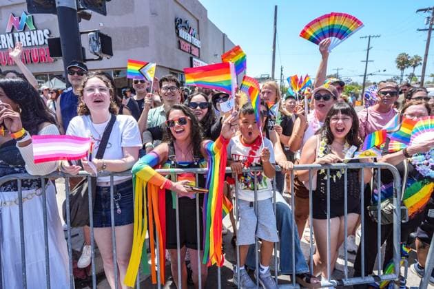 July 18, 2026, San Diego, California, Unted States: People cheer and wave the rainbow flags on the sidewalk during the parade..The 2026 San Diego Pride Parade fills the streets of Hillcrest area with color, energy, and a powerful sense of community as thousands of people gather to celebrate LGBTQ+ pride and equality on July 18th, 2026, in San Diego, California. Participants wave rainbow flags, dance alongside decorated floats, and cheer for local organizations, businesses, and advocacy groups that march through the streets. Allies line the parade route, creating an atmosphere of joy while also recognizing Pride s roots in the fight for equal rights. San Diego Unted States  - ZUMAs197 20260718_aaa_s197_131 Copyright: xWaixLeexMichaelxHox