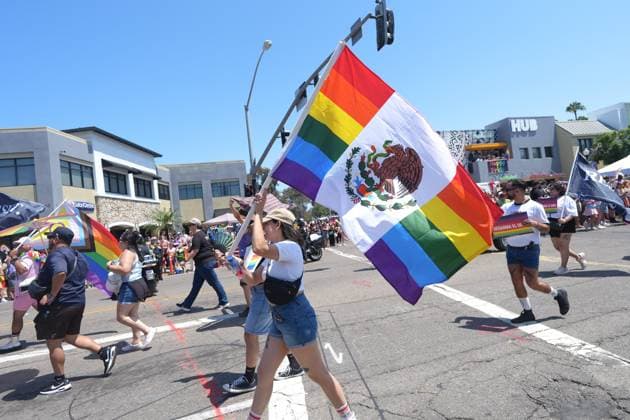 July 18, 2026, San Diego, California, Unted States: People march on the streets with rainbow flags during the parade..The 2026 San Diego Pride Parade fills the streets of Hillcrest area with color, energy, and a powerful sense of community as thousands of people gather to celebrate LGBTQ+ pride and equality on July 18th, 2026, in San Diego, California. Participants wave rainbow flags, dance alongside decorated floats, and cheer for local organizations, businesses, and advocacy groups that march through the streets. Allies line the parade route, creating an atmosphere of joy while also recognizing Pride s roots in the fight for equal rights. San Diego Unted States  - ZUMAs197 20260718_aaa_s197_133 Copyright: xWaixLeexMichaelxHox