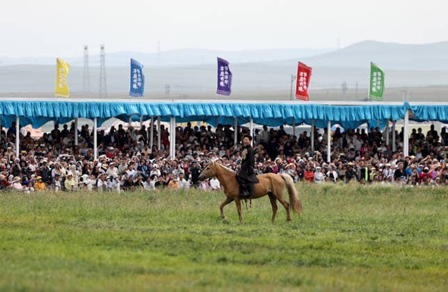 XILINGOL, CHINA - JULY 18: An artist performs with a horse at the opening ceremony of the 36th Naadam festival on July 18, 2026 in Xilingol League, Inner Mongolia Autonomous Region of China. The Naadam festival kicked off here on July 18. Naadam, usually held in mid-summer and sometimes in winter in pastoral areas of Inner Mongolia, means games in the Mongolian language. It often comprises wrestling, archery, and horse racing, also known as the Three Games of Men.  Copyright: xVCGx 111655158211
