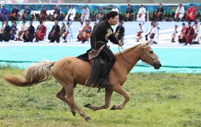 XILINGOL, CHINA - JULY 18: An artist performs with a horse at the opening ceremony of the 36th Naadam festival on July 18, 2026 in Xilingol League, Inner Mongolia Autonomous Region of China. The Naadam festival kicked off here on July 18. Naadam, usually held in mid-summer and sometimes in winter in pastoral areas of Inner Mongolia, means games in the Mongolian language. It often comprises wrestling, archery, and horse racing, also known as the Three Games of Men.  Copyright: xVCGx 111655158215