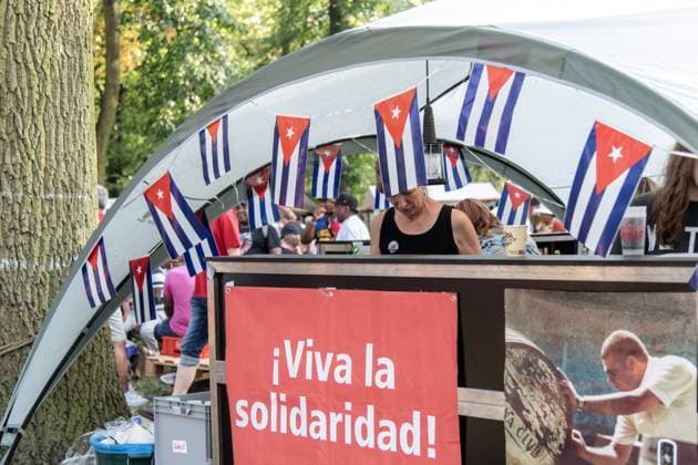 Solidarity Gathering with Cuba Held in Berlin BERLIN, GERMANY JULY 18, 2026: People gather at Stadtpark Lichtenberg under the slogan Learn from Cuba, Fight for Cuba, Celebrate with Cuba during an event expressing solidarity with the Caribbean nation. Participants called for an end to the United States embargo and international sanctions, which organisers said have contributed to decades of economic hardship in Cuba. Berlin Germany Copyright: x xAndrÃ sxTrujillox xJNAxPressx