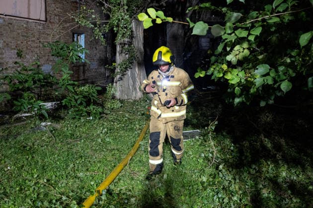 A firefighter works at a five-storey apartment block in the Solomianskyi district damaged by a Russian attack on Kyiv, Ukraine, July 19, 2026. The Russian army launched a massive strike on the Ukrainian capital with ballistic missiles. According to preliminary data from the State Emergency Service of Ukraine, one person was killed and 15 were injured. Falling debris and fires were reported in five districts of the city, while an underpass near the Lukianivska metro station sustained a direct hit. (Photo by Danylo Antoniuk Ukrinform) Russian army attacks Kyiv with ballistic missiles  Copyright: xDanyloxAntoniukx