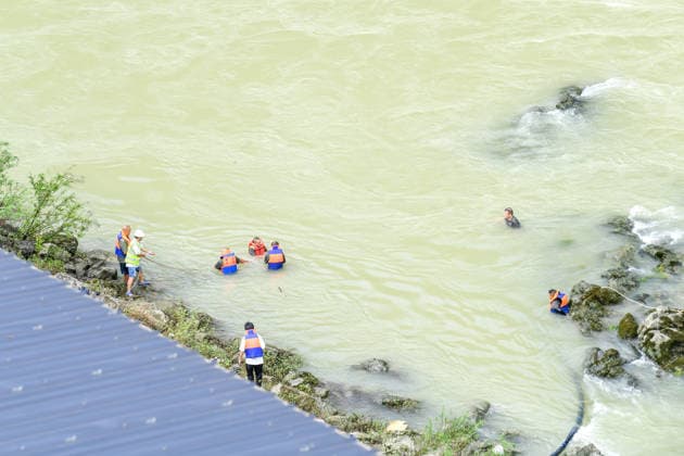 (260719) -- CHONGQING, July 19, 2026 -- Rescuers work at the site of a mountain collapse in Pengshui Miao and Tujia Autonomous County of Chongqing, southwest China, July 19, 2026. A rainfall-induced mountain collapse occurred at 9:08 a.m. on Friday in the Hanjia sub-district of Pengshui, burying more than 10 residential buildings, while leaving some local residents trapped and unaccounted for. China activated a Level-II national emergency response for geological disasters. Multiple rescue forces including emergency response, fire control and public security rushed to the scene and launched full-scale search and rescue operations, while local residents also volunteered to take part in the rescue efforts. ) CHINA-CHONGQING-PENGSHUI-MOUNTA 