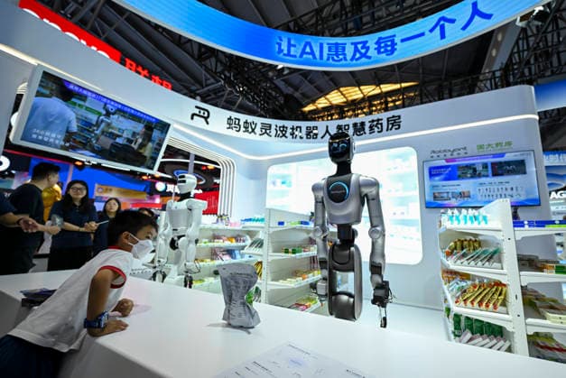 (260719) -- SHANGHAI, July 19, 2026 -- A visitor watches an intelligent robot pharmacy during the 2026 World AI Conference and High-Level Meeting on Global AI Governance in Shanghai, east China, July 19, 2026. The event scheduled from Friday to Monday showcases exhibitions of a number of AI agent hardware and system products, highlighting the transition of next-generation AI from a tool to an intelligent partner, empowering various industries and everyday life. ) CHINA-SHANGHAI-WORLD AI CONFERENCE-AI PRODUCTS (CN) ChenxHaoming 