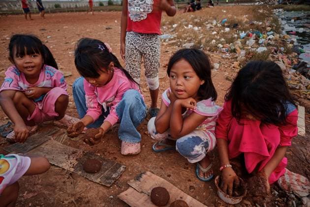 July 19, 2026, Jakarta, Indonesia: JAKARTA, INDONESIA Ã¢â‚¬ JULY 19, 2026: Children sit and play outside a house in Kampung Muara Baru, North Jakarta. According to the Jakarta Public Housing and Settlement Agency (DPRKP), high population density, limited land for infrastructure development, zoning constraints and land tenure issues remain among the main challenges to improving informal settlements in the Indonesian capital. JNA Press Jakarta Indonesia  - ZUMAq101 20260719_zna_q101_087 Copyright: xMuhammadxRizkyxFebriansyahx
