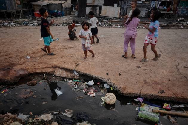 July 19, 2026, Jakarta, Indonesia: JAKARTA, INDONESIA Ã¢â‚¬ JULY 19, 2026: Children sit and play outside a house in Kampung Muara Baru, North Jakarta. According to the Jakarta Public Housing and Settlement Agency (DPRKP), high population density, limited land for infrastructure development, zoning constraints and land tenure issues remain among the main challenges to improving informal settlements in the Indonesian capital. JNA Press Jakarta Indonesia - ZUMAq101 20260719_zna_q101_083 Copyright: xMuhammadxRizkyxFebriansyahx