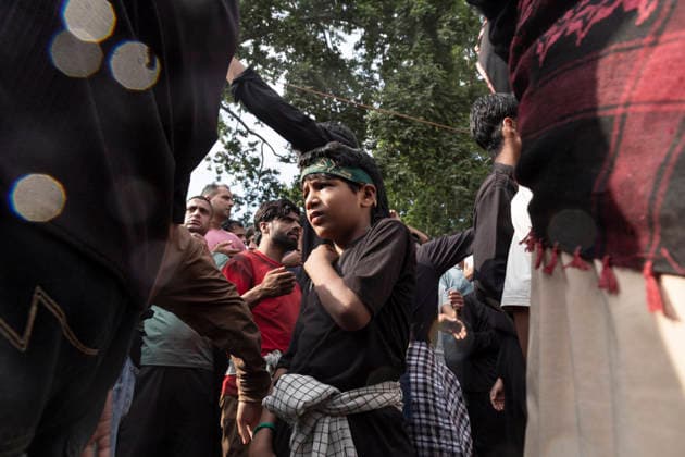 July 19, 2026, Budgam, Jammu And Kashmir, India: A Shiite boy wearing a religious headband takes part in a procession on the fourth day of Safar in Magam. Safar, the second month of the Islamic calendar, follows Muharram and continues the mourning of Imam Hussain. According to Shia tradition, the 4th of safar, 61 AH, marks the imprisonment of the Prophet s household (Ahl al-Bayt) in Kufa under the orders of Ubaydullah ibn Ziyad after the Battle of Karbala. Budgam India  - ZUMAa205 20260719_zip_a205_013 Copyright: xAdilxAbassx