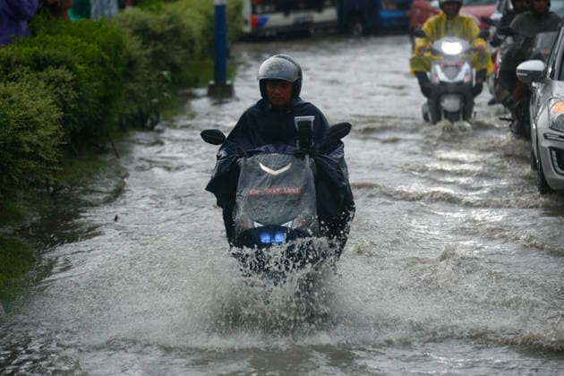 Monsoon Rains Inundate Roads In Central Kathmandu Commuters wade through a waterlogged road after heavy monsoon rainfall inundated the Maitighar Mandala area in Kathmandu, Nepal, on July 19, 2026. Continuous rain caused localized flooding and disrupted traffic and daily life in several parts of the capital, with pedestrians and motorists navigating through floodwaters as the monsoon season continues. Kathmandu Nepal  Copyright: xSanjitxPariyarx originalFilename: pariyar-notitle260719_npIbD.jpg