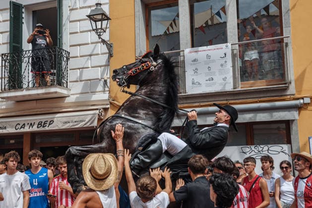 July 19, 2026, Es Mercadal, Menorca Balearic Islands, Spain: A caixer, or horse rider, rears his horse amid a cheering crowd during the traditional Jaleo at the Sant MartoÂ­ Festival in Es Mercadal. Es Mercadal Spain - ZUMAo105 20260719_fap_o105_012 Copyright: xMatthiasxOesterlex