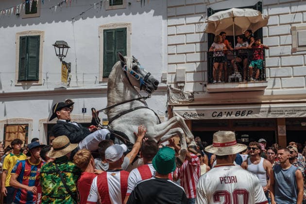 July 19, 2026, Es Mercadal, Menorca Balearic Islands, Spain: A caixer, or horse rider, rears his horse amid a cheering crowd during the traditional Jaleo at the Sant MartoÂ­ Festival in Es Mercadal. Es Mercadal Spain - ZUMAo105 20260719_fap_o105_017 Copyright: xMatthiasxOesterlex