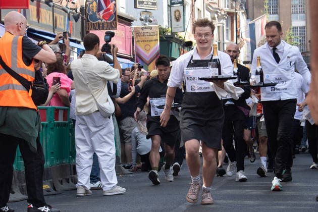 SOHO Waiters Race at SOHO, London, UK - Sun 19 July 2026 Waiters from various London restaurants take part in the annual SOHO Waiters Race, balancing a champagne bottle and a glass around SOHO in London, England, UK on Sunday 19 July 2026 as part of the SOHO Village Fete., Credit:Justin Ng Avalon UK, England, London, SOHO  Copyright: xJustinxNgx xAvalonx 1117372134