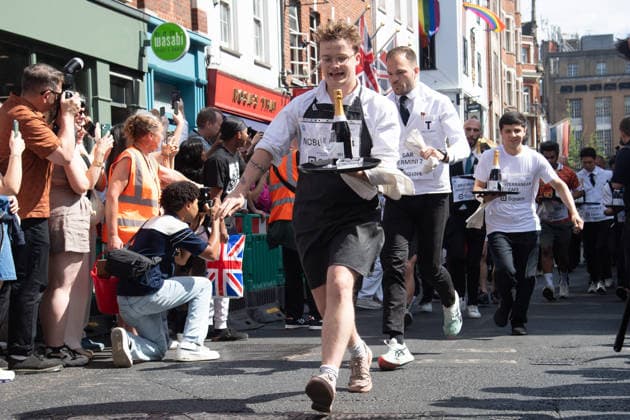 SOHO Waiters Race at SOHO, London, UK - Sun 19 July 2026 Waiters from various London restaurants take part in the annual SOHO Waiters Race, balancing a champagne bottle and a glass around SOHO in London, England, UK on Sunday 19 July 2026 as part of the SOHO Village Fete., Credit:Justin Ng Avalon UK, England, London, SOHO  Copyright: xJustinxNgx xAvalonx 1117372137