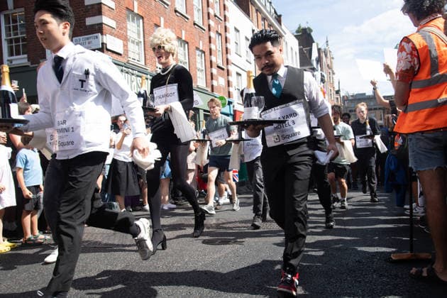 SOHO Waiters Race at SOHO, London, UK - Sun 19 July 2026 Waiters from various London restaurants take part in the annual SOHO Waiters Race, balancing a champagne bottle and a glass around SOHO in London, England, UK on Sunday 19 July 2026 as part of the SOHO Village Fete., Credit:Justin Ng Avalon UK, England, London, SOHO  Copyright: xJustinxNgx xAvalonx 1117372150