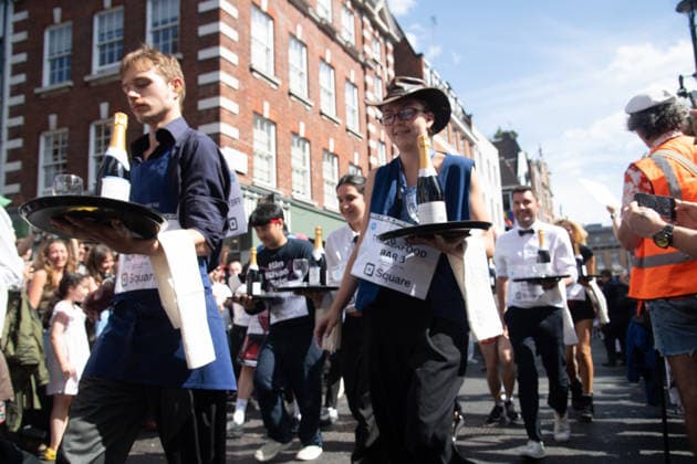 SOHO Waiters Race at SOHO, London, UK - Sun 19 July 2026 Waiters from various London restaurants take part in the annual SOHO Waiters Race, balancing a champagne bottle and a glass around SOHO in London, England, UK on Sunday 19 July 2026 as part of the SOHO Village Fete., Credit:Justin Ng Avalon UK, England, London, SOHO  Copyright: xJustinxNgx xAvalonx 1117372160