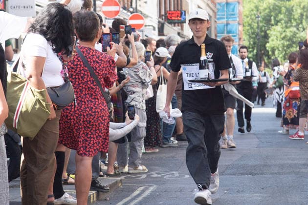 SOHO Waiters Race at SOHO, London, UK - Sun 19 July 2026 Waiters from various London restaurants take part in the annual SOHO Waiters Race, balancing a champagne bottle and a glass around SOHO in London, England, UK on Sunday 19 July 2026 as part of the SOHO Village Fete., Credit:Justin Ng Avalon UK, England, London, SOHO  Copyright: xJustinxNgx xAvalonx 1117372175
