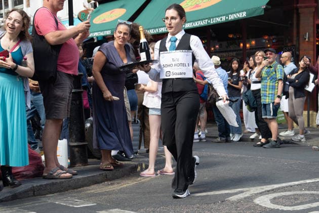 SOHO Waiters Race at SOHO, London, UK - Sun 19 July 2026 Waiters from various London restaurants take part in the annual SOHO Waiters Race, balancing a champagne bottle and a glass around SOHO in London, England, UK on Sunday 19 July 2026 as part of the SOHO Village Fete., Credit:Justin Ng Avalon UK, England, London, SOHO  Copyright: xJustinxNgx xAvalonx 1117372208