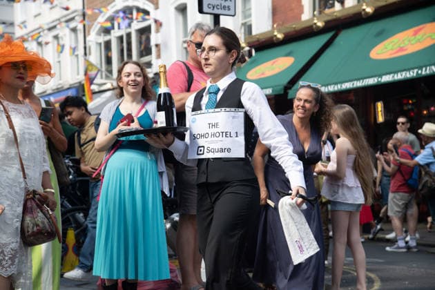SOHO Waiters Race at SOHO, London, UK - Sun 19 July 2026 Waiters from various London restaurants take part in the annual SOHO Waiters Race, balancing a champagne bottle and a glass around SOHO in London, England, UK on Sunday 19 July 2026 as part of the SOHO Village Fete., Credit:Justin Ng Avalon UK, England, London, SOHO  Copyright: xJustinxNgx xAvalonx 1117372214