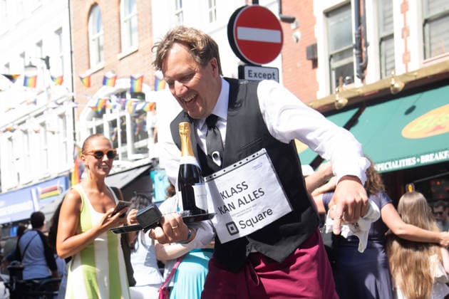 SOHO Waiters Race at SOHO, London, UK - Sun 19 July 2026 Waiters from various London restaurants take part in the annual SOHO Waiters Race, balancing a champagne bottle and a glass around SOHO in London, England, UK on Sunday 19 July 2026 as part of the SOHO Village Fete., Credit:Justin Ng Avalon UK, England, London, SOHO  Copyright: xJustinxNgx xAvalonx 1117372229