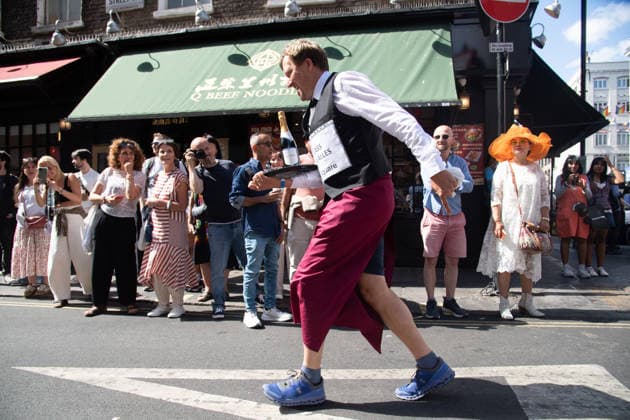 SOHO Waiters Race at SOHO, London, UK - Sun 19 July 2026 Waiters from various London restaurants take part in the annual SOHO Waiters Race, balancing a champagne bottle and a glass around SOHO in London, England, UK on Sunday 19 July 2026 as part of the SOHO Village Fete., Credit:Justin Ng Avalon UK, England, London, SOHO  Copyright: xJustinxNgx xAvalonx 1117372232