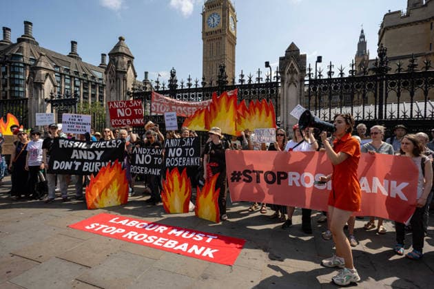 Fossil Free London Protest against Rosebank Oil Field outside Parliament, London, UK 18 July 2026 Campaigners from Fossil Free London demonstrate outside Parliament, London, UK, on 18 July 2026, with placards and banners calling on incoming Prime Minister Andy Burnham not to approve the Rosebank oil field or new North Sea drilling. The protest follows the UK s third heatwave in as many months, during which official statistics recorded over 2,700 heat-related deaths across England and Wales., Credit:Pete Speller Avalon  Copyright: xPetexSpellerx xAvalonx 1117383388