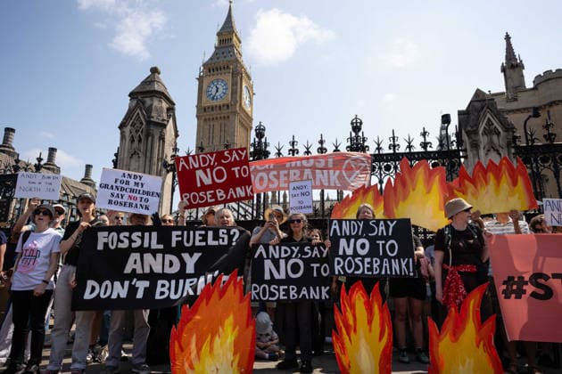 Fossil Free London Protest against Rosebank Oil Field outside Parliament, London, UK 18 July 2026 Campaigners from Fossil Free London demonstrate outside Parliament, London, UK, on 18 July 2026, with placards and banners calling on incoming Prime Minister Andy Burnham not to approve the Rosebank oil field or new North Sea drilling. The protest follows the UK s third heatwave in as many months, during which official statistics recorded over 2,700 heat-related deaths across England and Wales., Credit:Pete Speller Avalon  Copyright: xPetexSpellerx xAvalonx 1117383461
