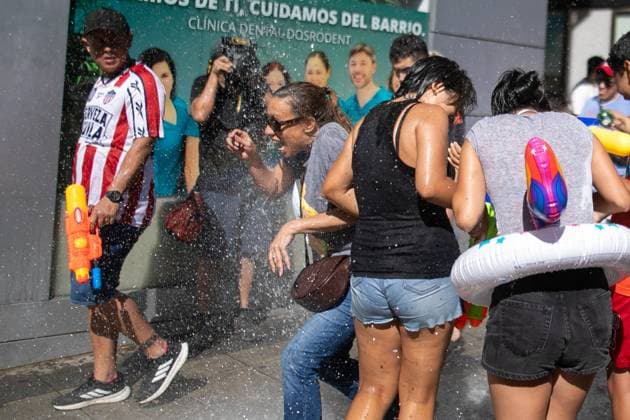 July 19, 2026, Madrid, Madrid, Spain: A woman screams as she is splashed on a street in the Vallecas neighborhood.during the Water Battle in the working-class neighborhood of Vallecas, Madrid. This celebration began in 1981 due to the high temperatures, when residents started throwing water at each other. It is also part of the festivities for the Virgen del Carmen, patron saint of sailors. Madrid Spain  - ZUMAs197 20260719_aaa_s197_135 Copyright: xDavidxCanalesx