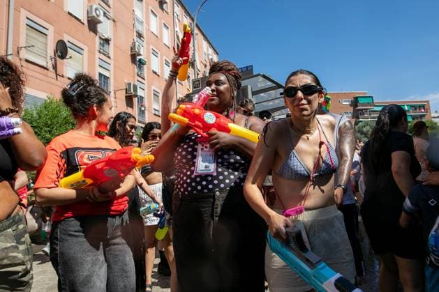 July 19, 2026, Madrid, Madrid, Spain: Participants in the Water Battle of Vallecas throw water at each other.during the Water Battle in the working-class neighborhood of Vallecas, Madrid. This celebration began in 1981 due to the high temperatures, when residents started throwing water at each other. It is also part of the festivities for the Virgen del Carmen, patron saint of sailors. Madrid Spain - ZUMAs197 20260719_aaa_s197_141 Copyright: xDavidxCanalesx