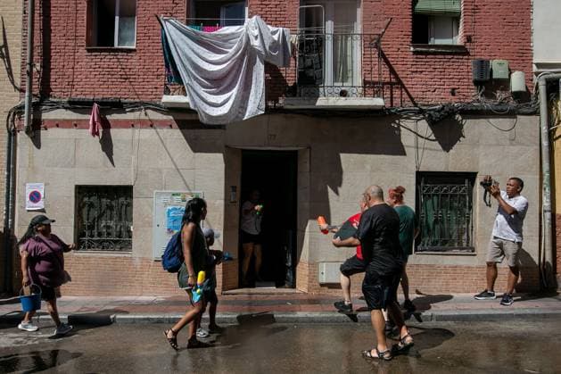 July 19, 2026, Madrid, Madrid, Spain: MADRID, SPAIN Ã¢â‚¬ JULY 19, 2026: People take part in the annual Water Battle in the working-class neighborhood of Vallecas, Madrid. The tradition began in 1981 as residents sought relief from the summer heat and is now held as part of the festivities honoring the Virgen del Carmen, the patron saint of sailors. JNA Press Madrid Spain - ZUMAq101 20260719_zna_q101_257 Copyright: xC.xCarvajalx